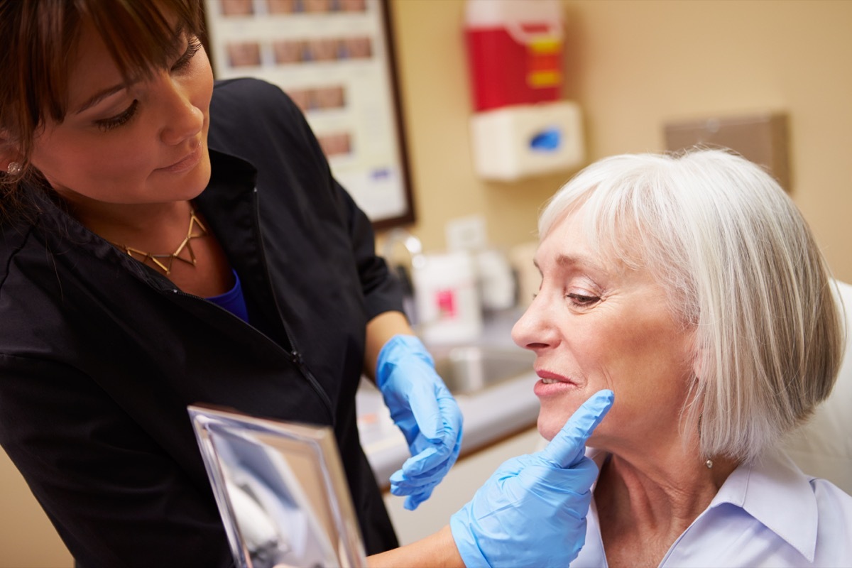 Older woman seeing plastic surgeon