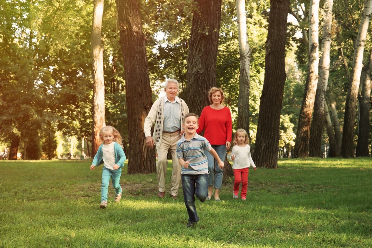 grandparents playing at the park with grandkids