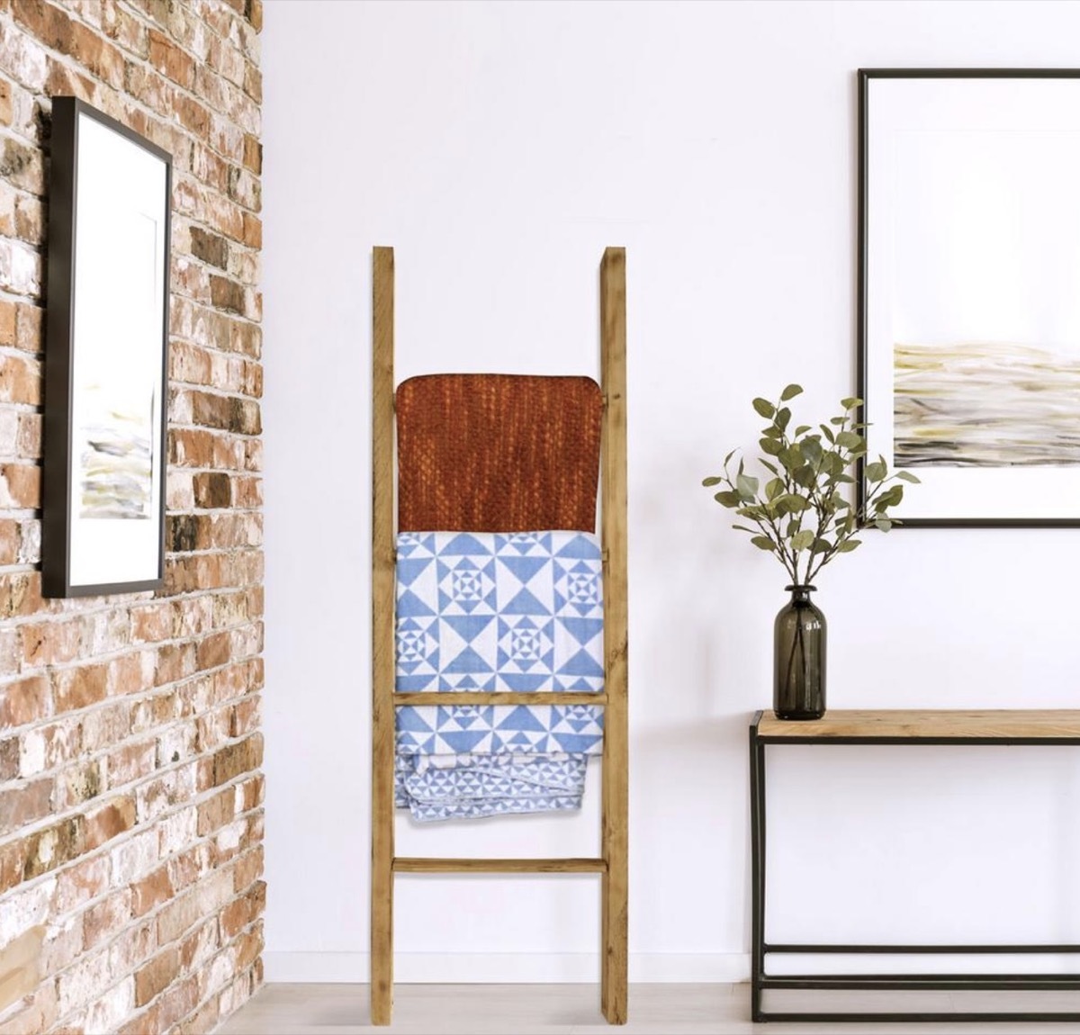 wooden ladder leaning against white wall adjacent to brick wall, rustic farmhouse decor