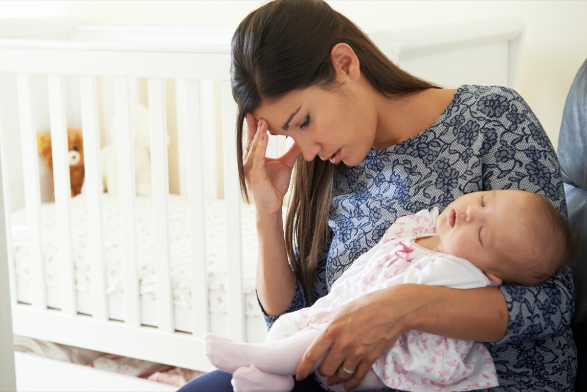 Tired Mother Suffering From Post Natal Depression