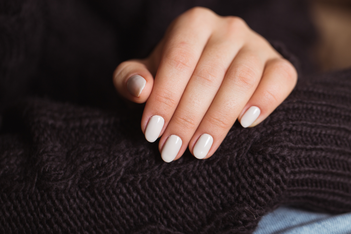 Beautiful woman nails with a beautiful bright manicure