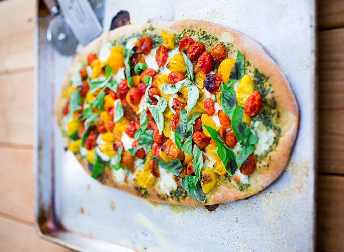 caprese pizza on baking tray