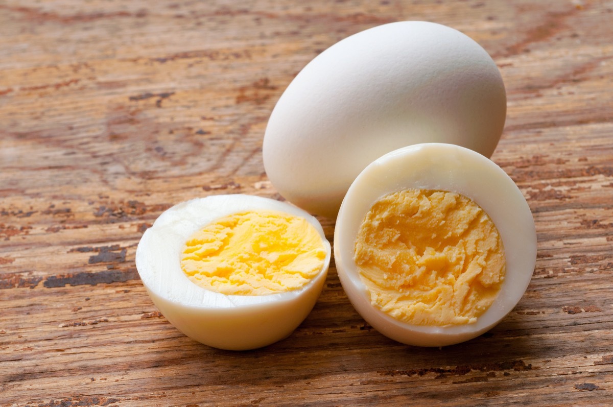 Hard-boiled eggs on wood surface