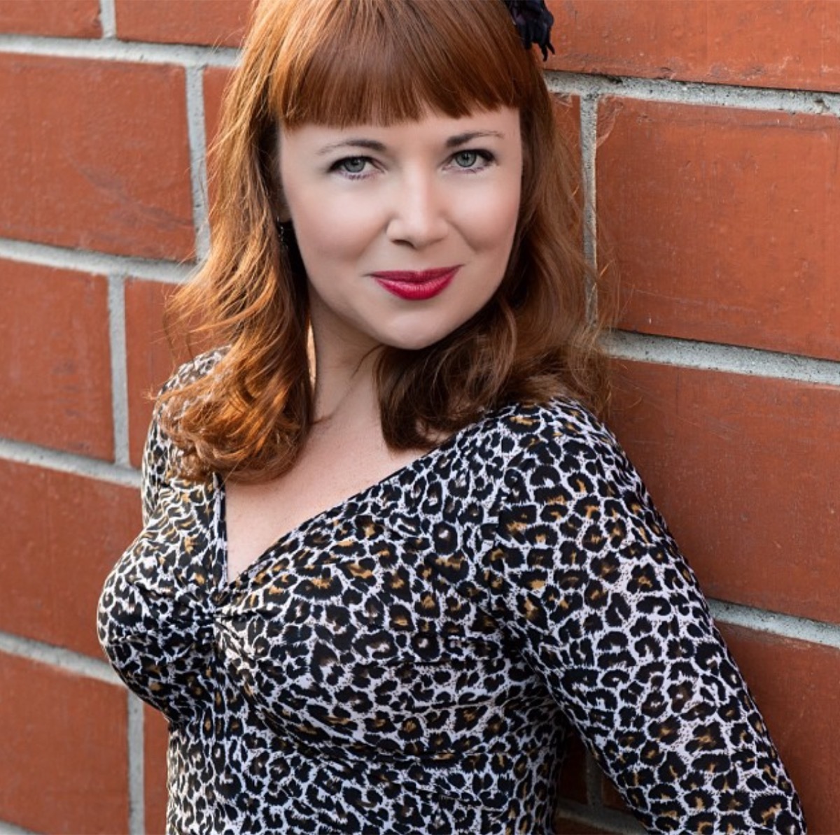 Little Orphan Annie Aileen Quinn in leopard print dress