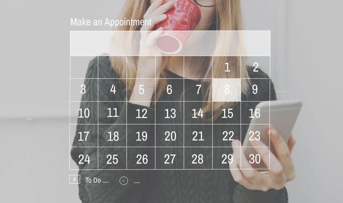 Woman drinking coffee and scheduling appointment