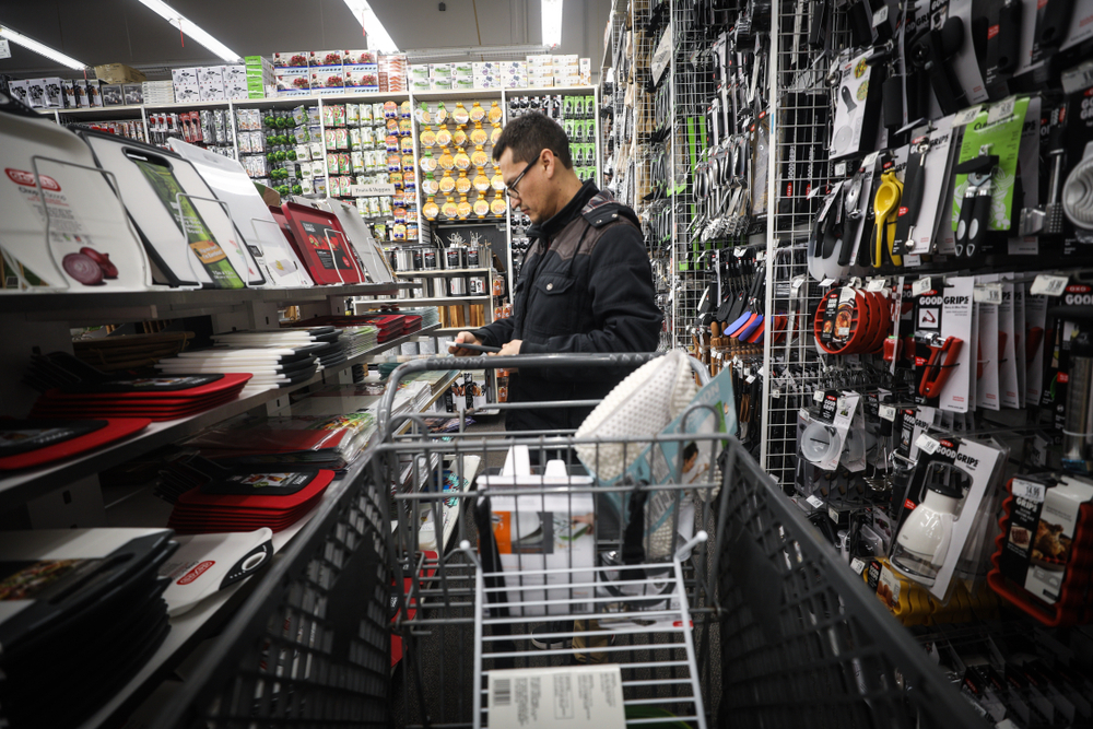 A man shopping in a bed bath & beyond store