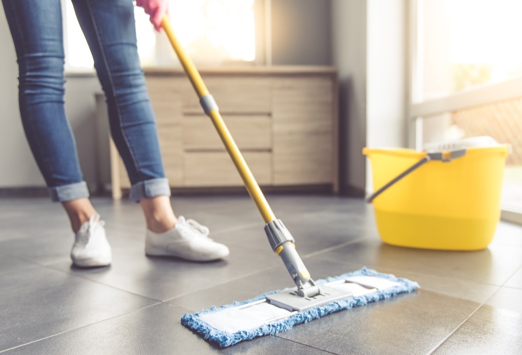 Woman doing chores in the morning.