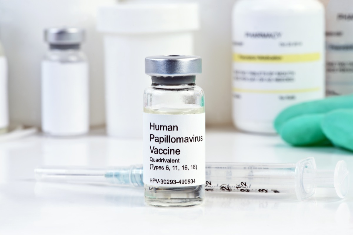 Human Papilloma Virus vaccine with syringe and vial on white counter top