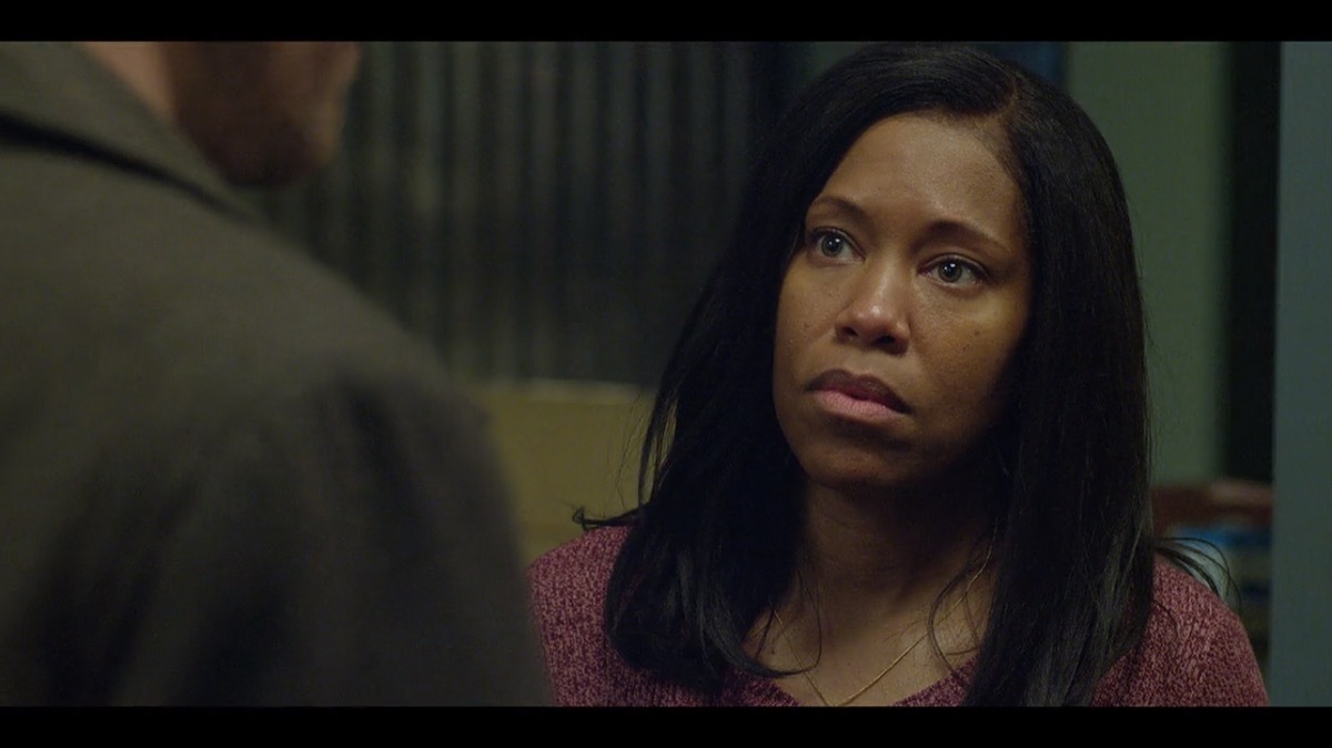 Regina King opens door and looks surprised in canceled Netflix series Seven Seconds