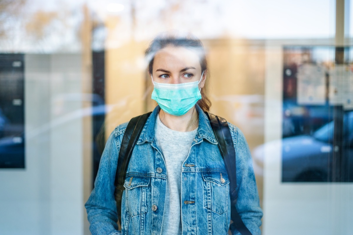 Worried woman wearing a protective medical mask White House vaccine supply discussion