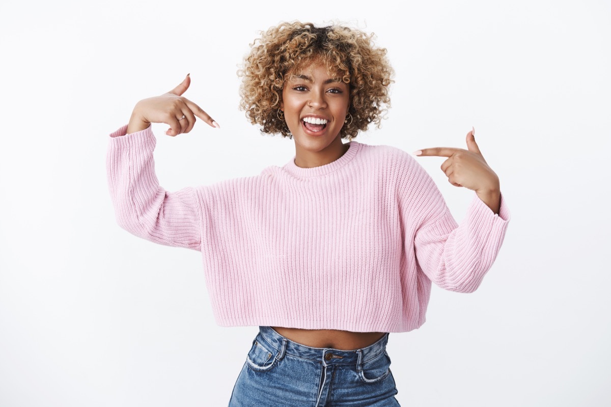 woman pointing at herself