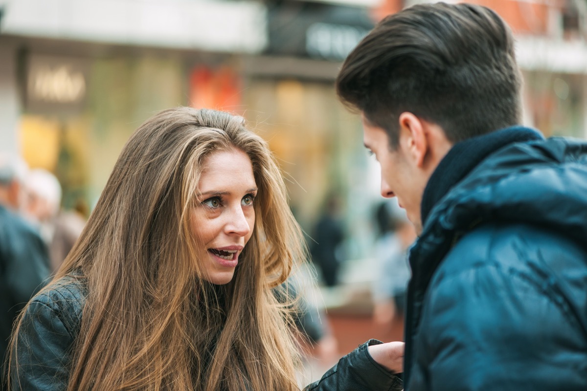 young couple quarreling because of disagreements - outdoors