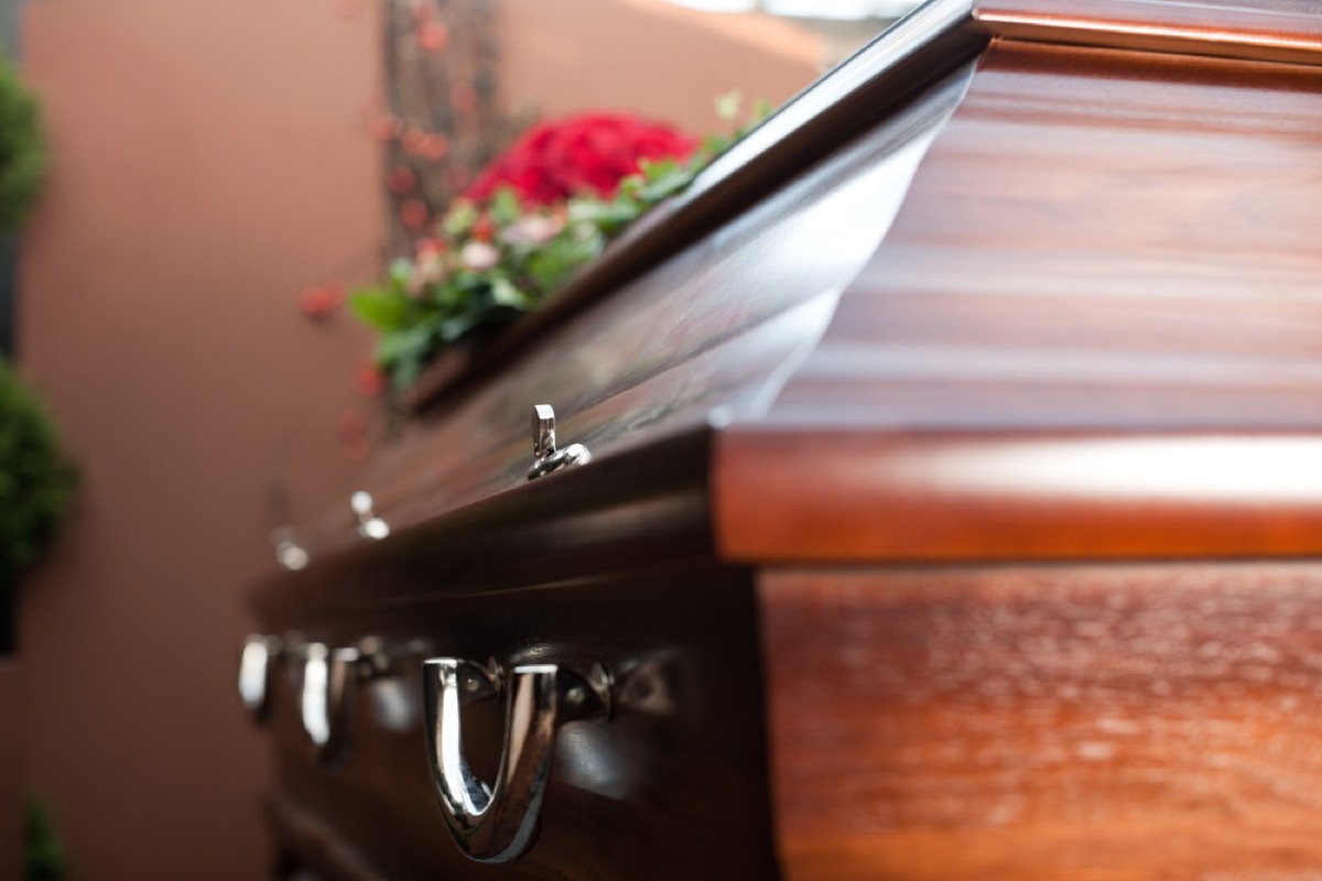 closeup of casket with flowers